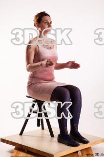 Sitting reference of whole body pink dress purple tights black…